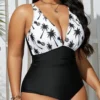 Maillot de bain gainant noir & blanc - Décolleté plongeant (vue de face) Maillot de bain gainant noir & blanc - Décolleté plongeant