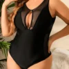 Maillot de bain noir sculptant à empiècements tulle